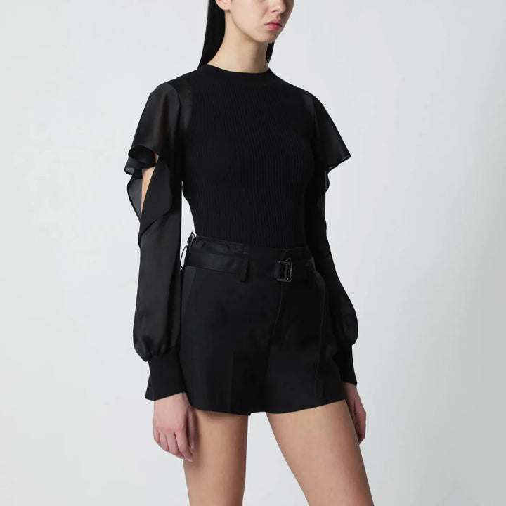 Sacai - Black knit top with semi-sheer sleeves