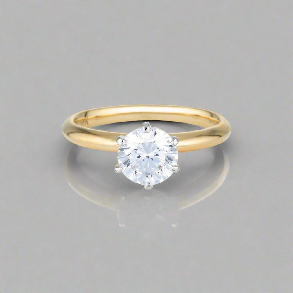 Georgini Ring 6 Georgini Gold Round Brilliant Cut 1.25ctw Moissanite Solitaire With Knife Edge Band In Yellow Gold Georgini Gold Round Brilliant Cut 1.25ctw Moissanite Solitaire With Knife Edge Band In Yellow Gold Brand